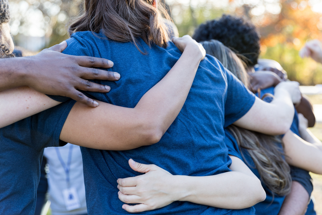 Group of people hugging